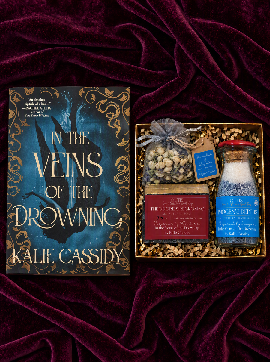 In the Veins of the Drowning and its bath collection laid on plum velvet